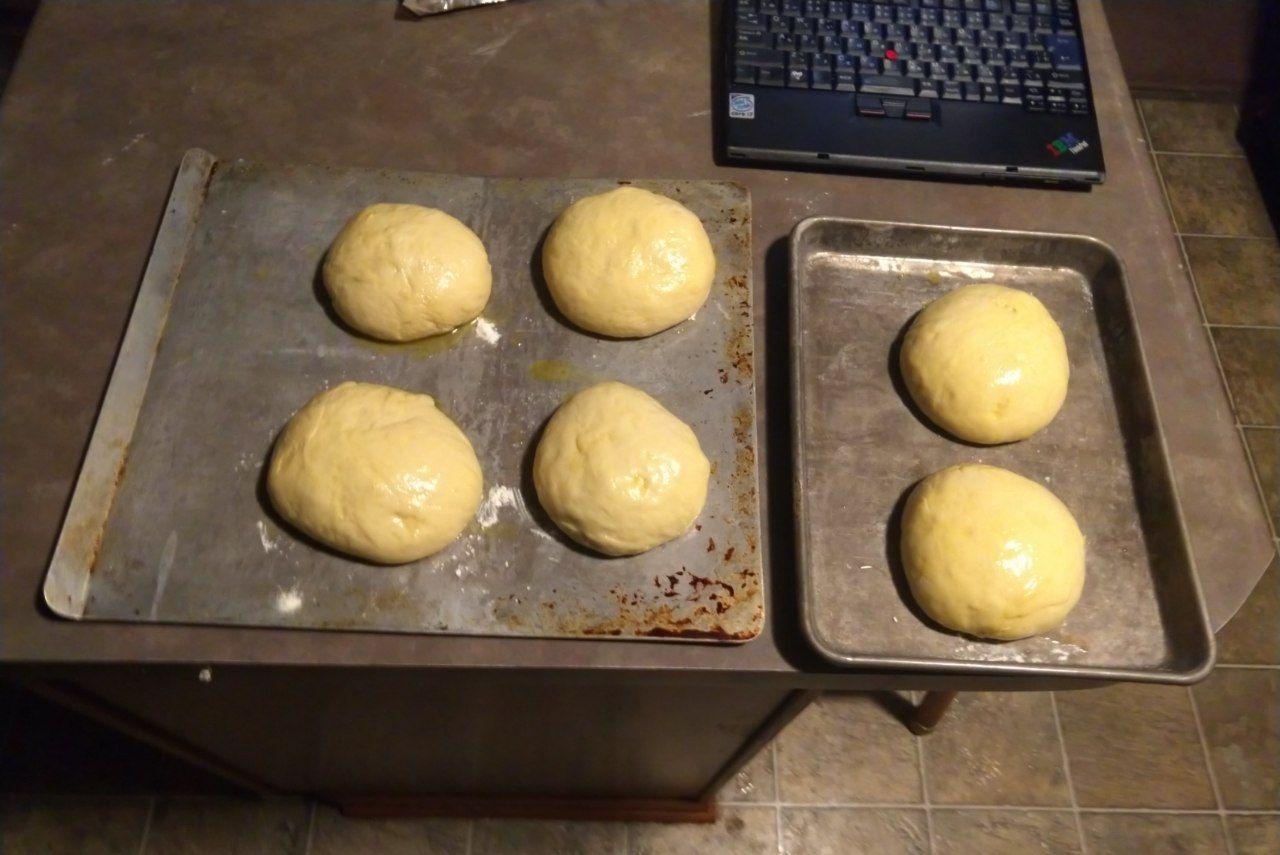 Buns after brushing with egg wash.