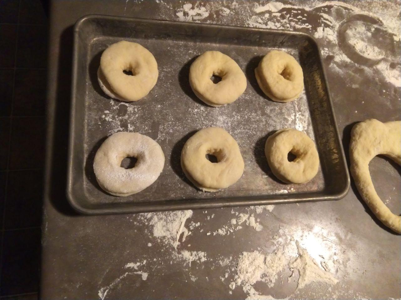 Donuts cut to shape, ready to rise.