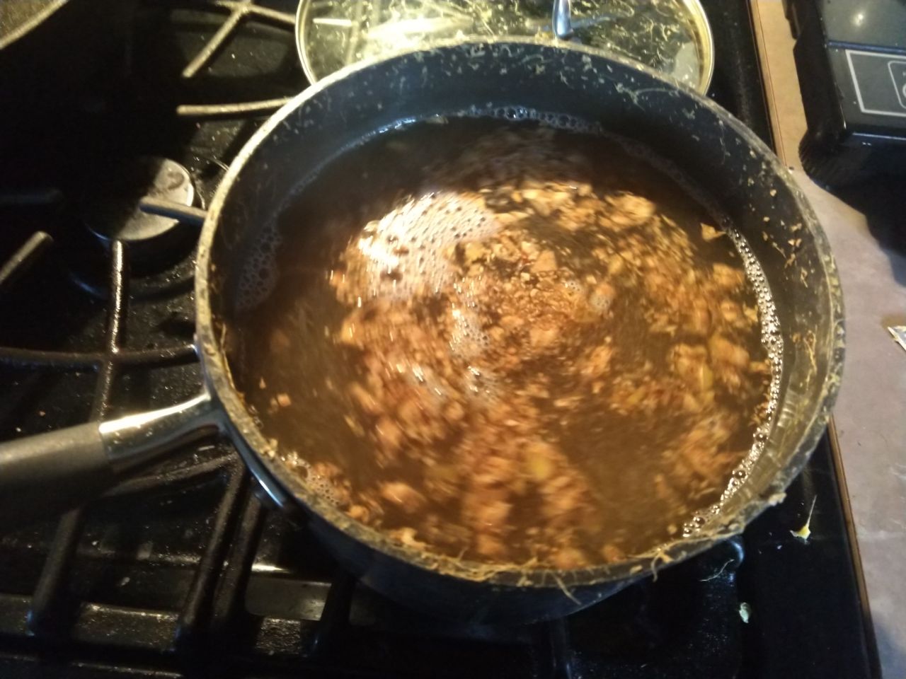 Boiling ginger with water and sugar.