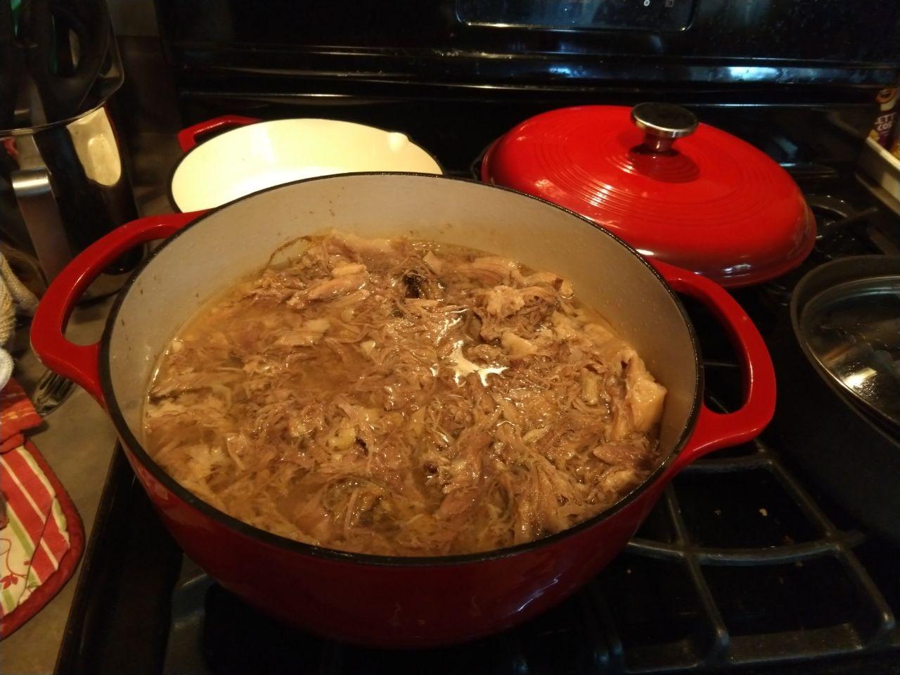 Dutch oven with shredded kalua pork.