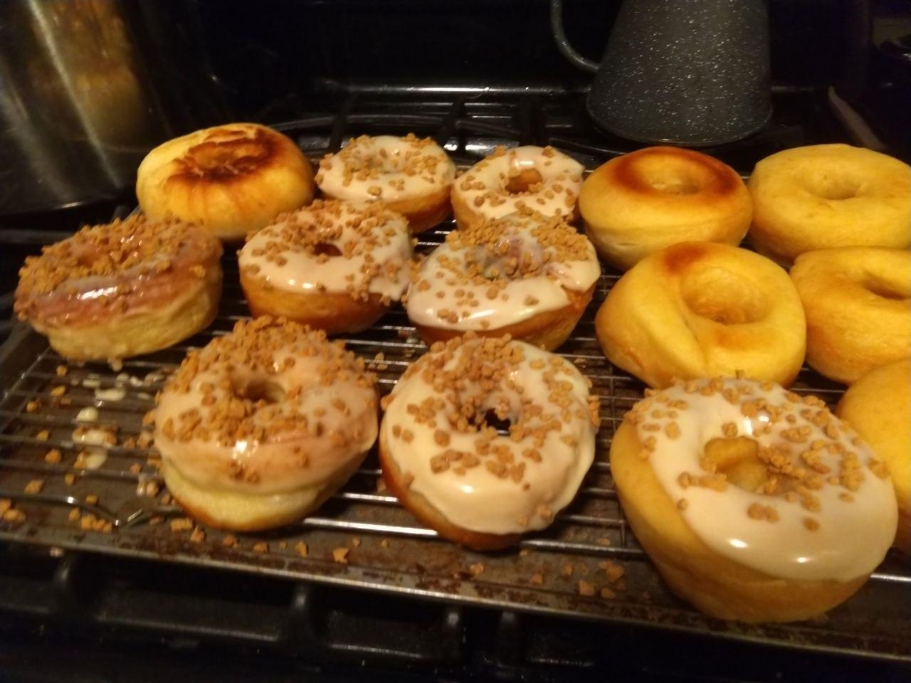 Maple glazed donuts with maple crumbles on top.