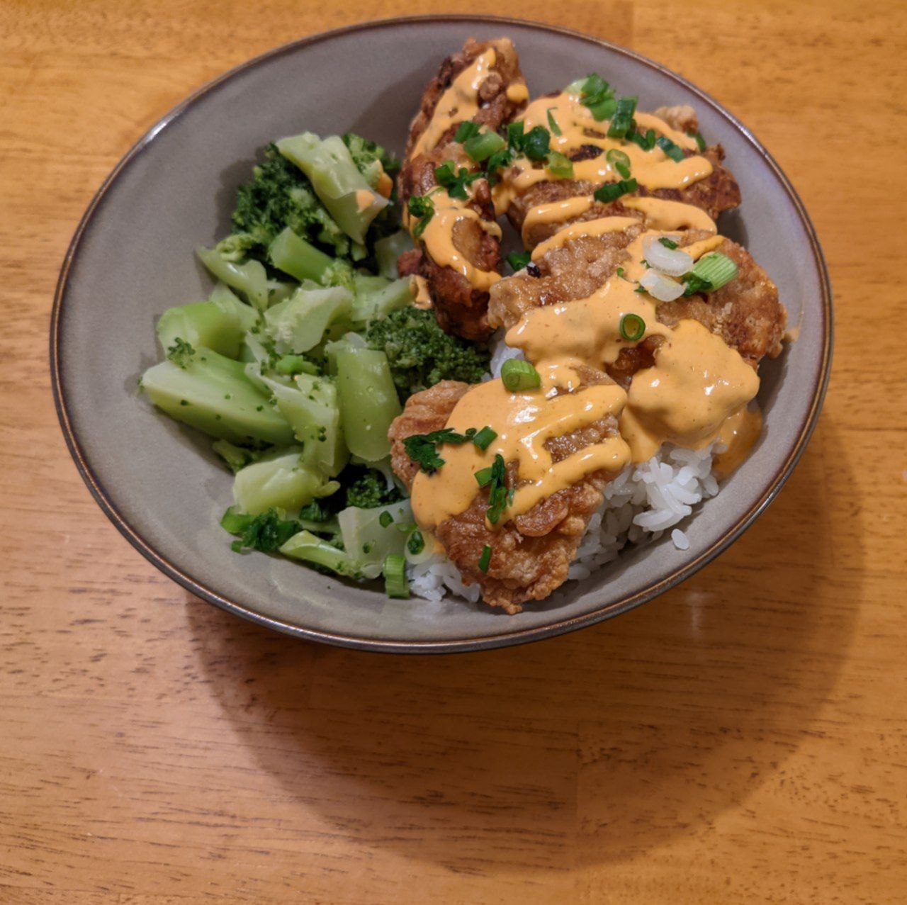 Bowl of mochiko chicken with spicy mayo.