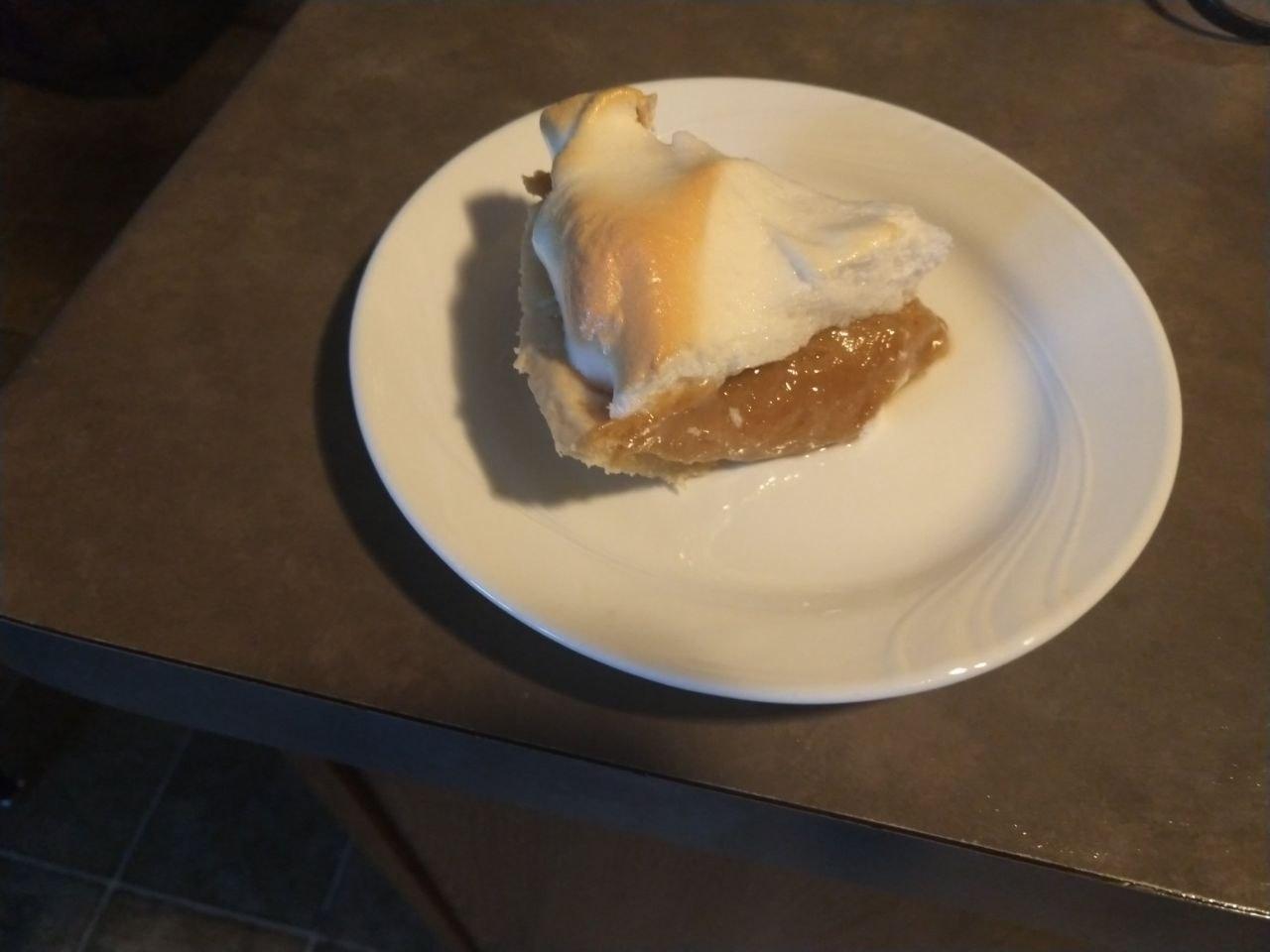 Slice of peanut butter pie on a plate. Same recipe, with peanut butter instead of cocoa powder in the custard.
