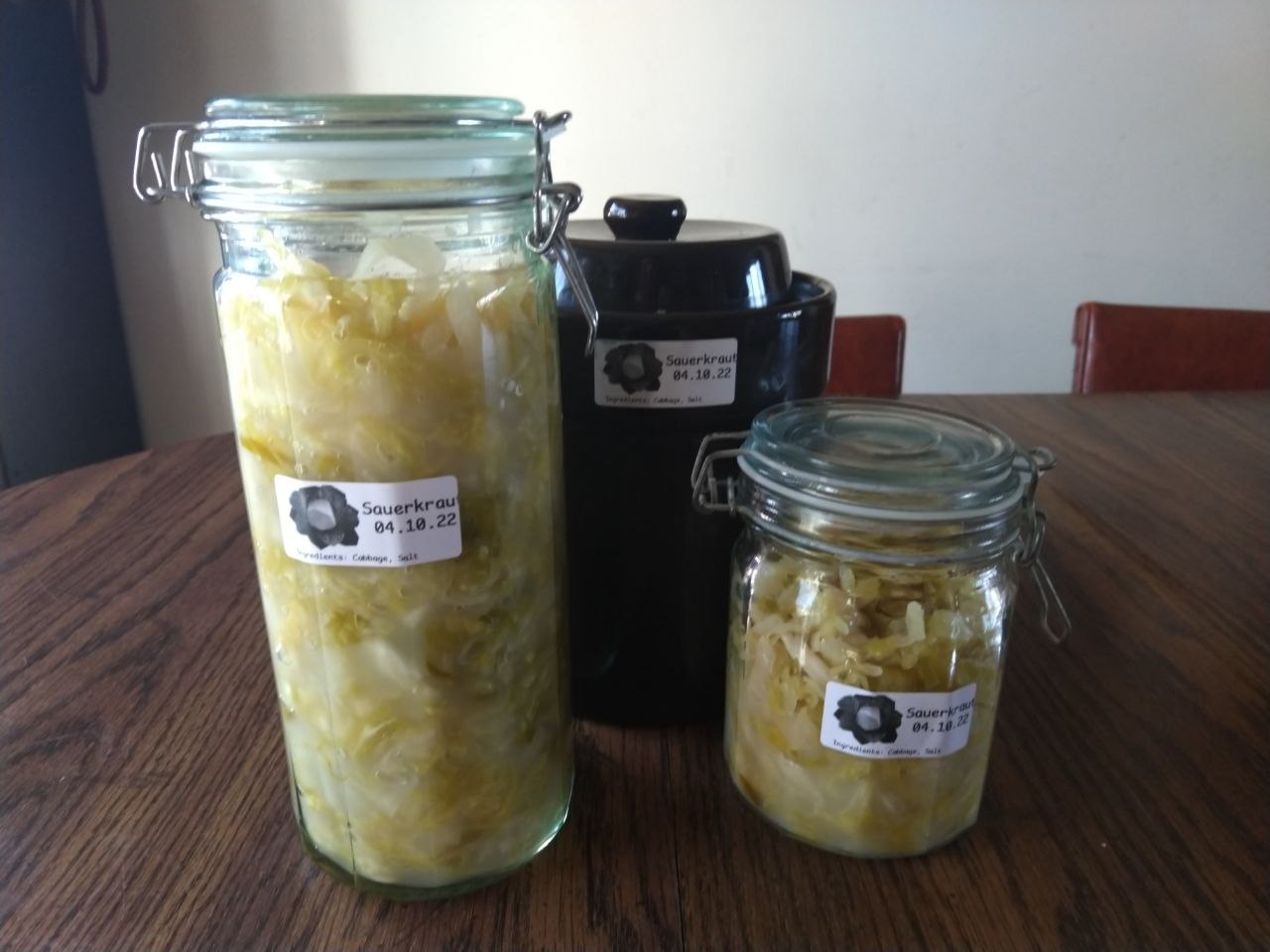 Sauerkraut moved out of crock into glass jars.